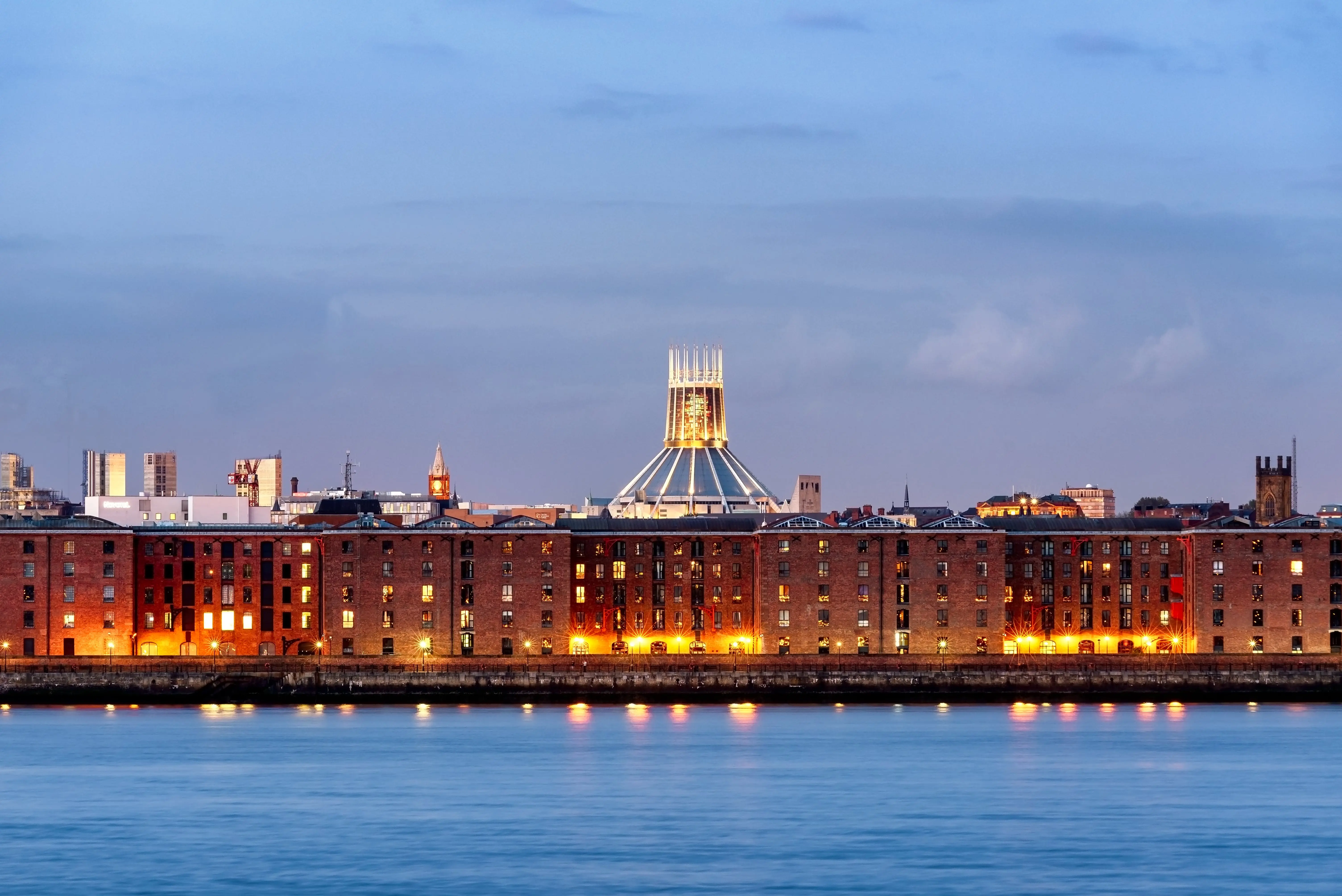 Liverpool waterfront skyline with its albert dock , ware houses and Anglecan cathedral, UK.