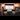 Train Carriages: A vintage train compartment with plush seating, cups of tea and warm ambient light