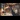 Train Carriages: Elegant vintage train dining car with plush seating, table lamps, and white tablecloths