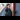 Rail Queens: Female train conductor in a high-visibility jacket standing at the entrance of train, smiling confidently