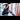 Underground Trains: A woman looks at her phone whilst waiting to board an Underground train.