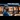 Train Departure Boards: A young businessman holding his phone looks up at an off-screen departure board or time table