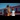 Bicentennial: Mother and daughter holding hands at a train station, preparing to board a red train