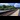 Community Rails: A commuter rail train stop during the day