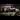 Famous Train Spotters: A close-up of a model steam train going along a model railway track.