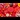 Chinese New Year decorations and foods on a red background,