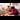 A family of three arranges a festive dining table to celebrate the Chinese New Year.