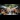 Blurred background of a vibrant food festival scene with lively crowds gathered around various food stalls.