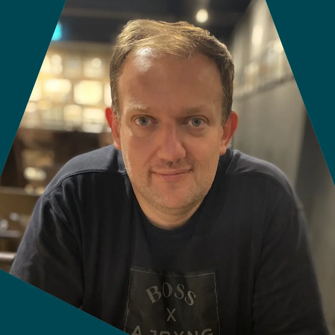 Richard Clinnick headshot with spark border