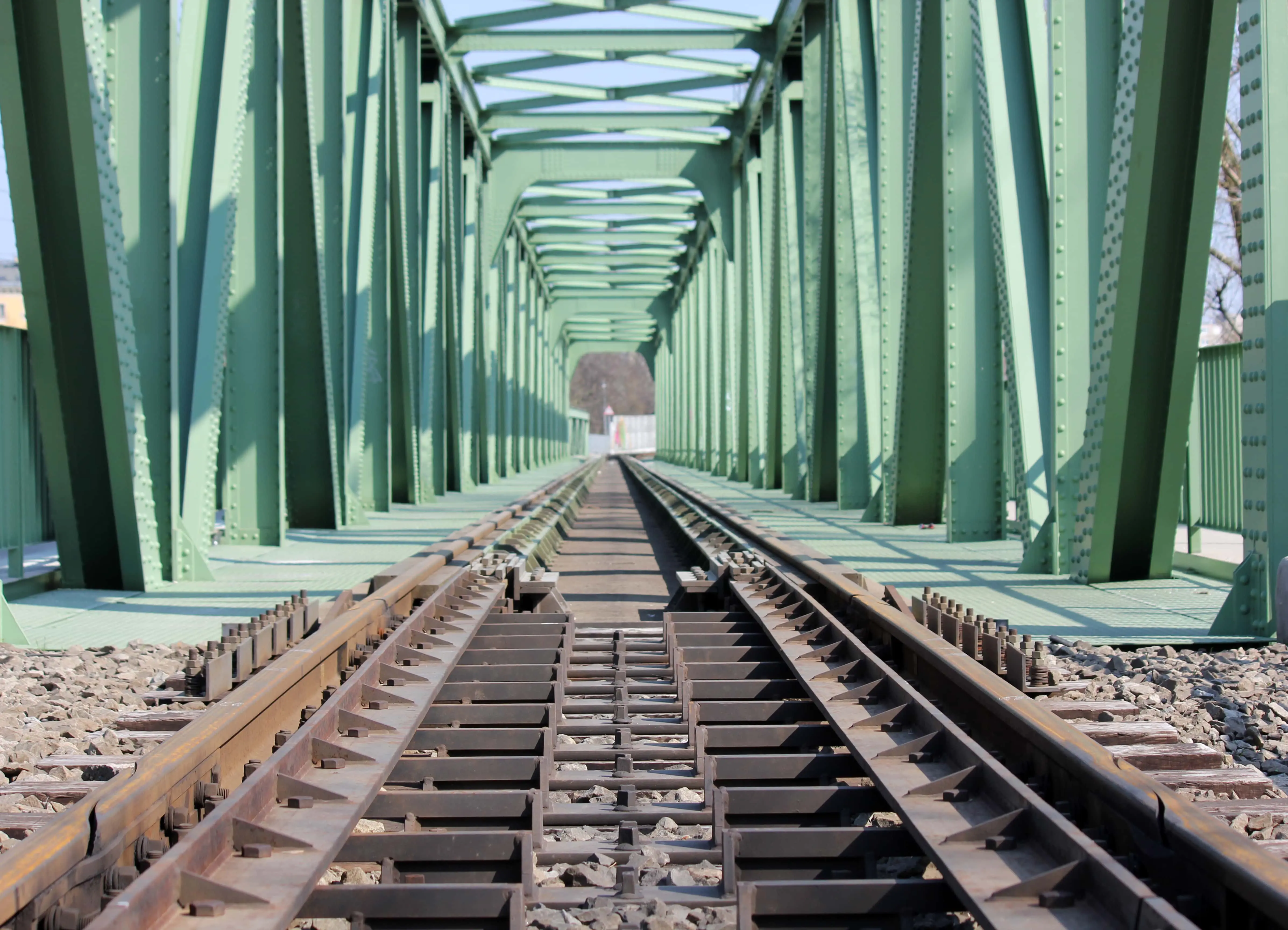 Old Railway Routes: An old railway bridge with a rusted, disused railway line.