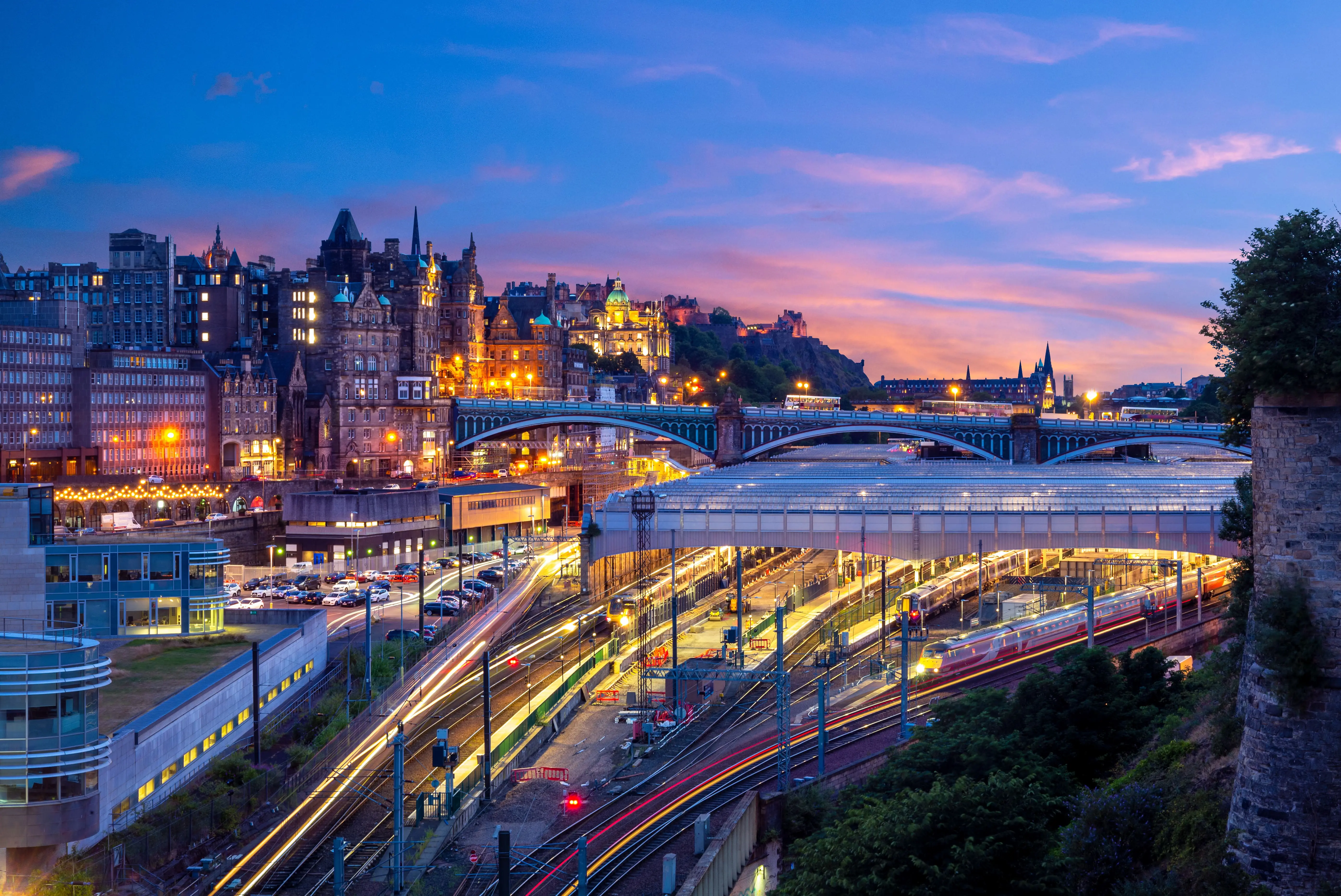 Community Rails: Night view of a train station in Edinburgh