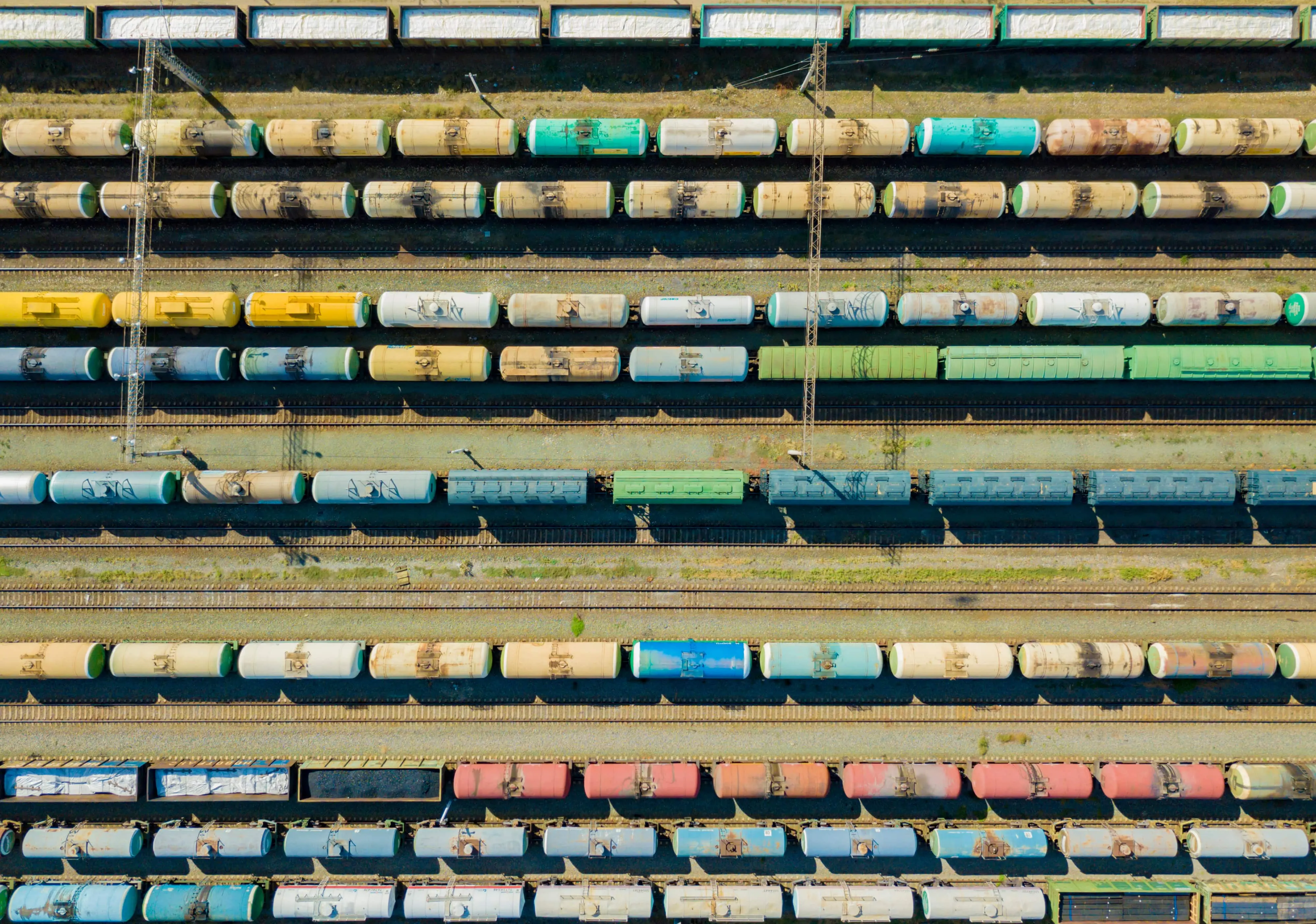 An aerial view of numerous freighter carriages and tanks.