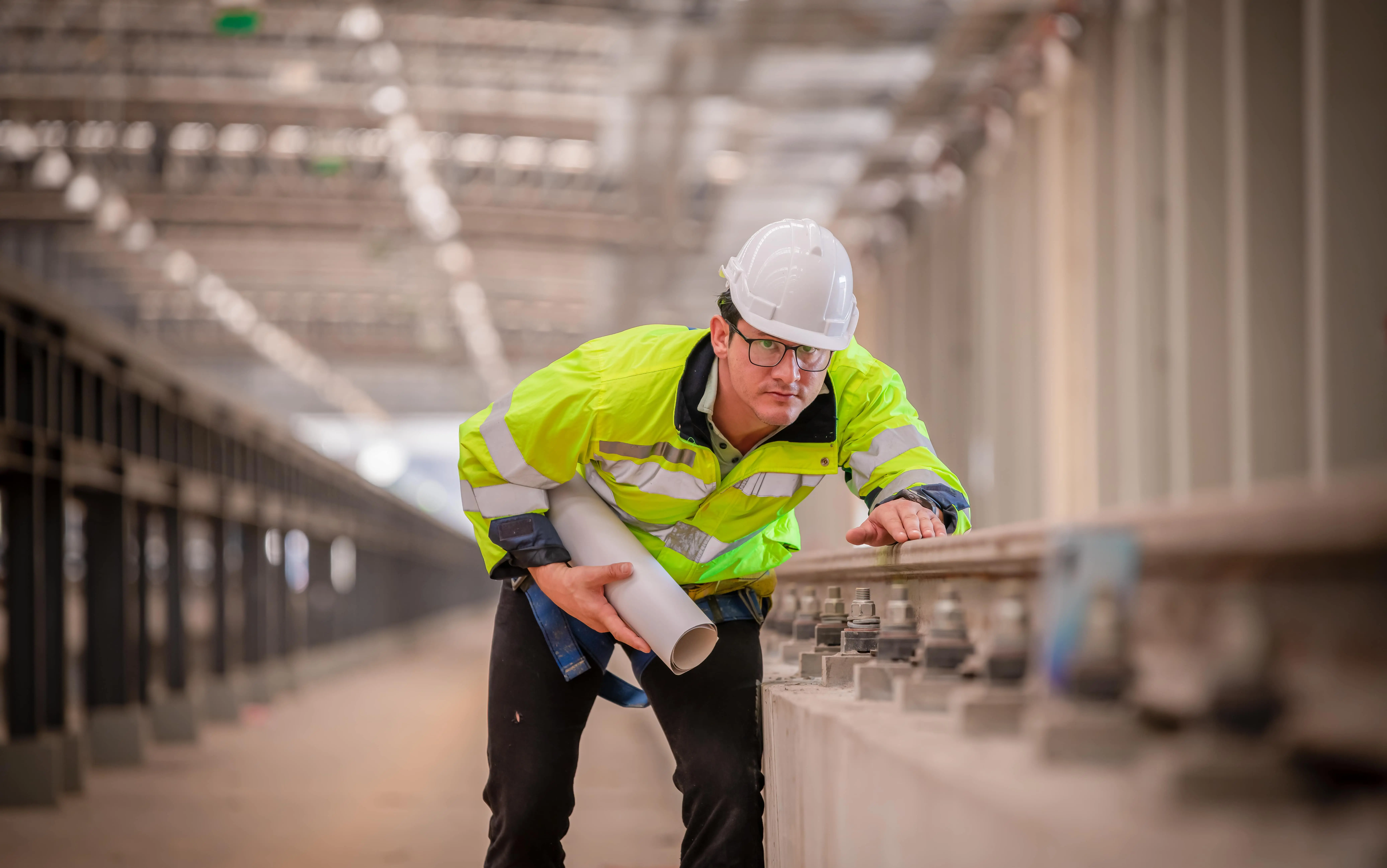 UK Locomotives: Electric: Two railway engineers supervising ongoing development of new railway lines.