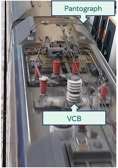 A pantograph and VCB labelled on the top of a train