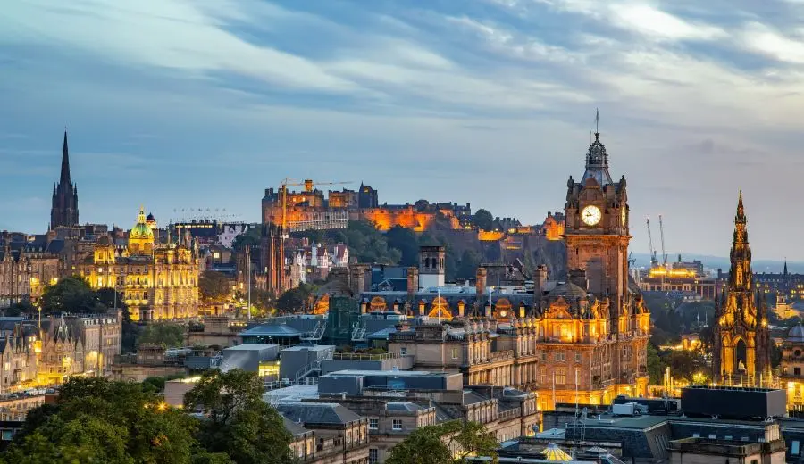  View from Calton Hill of Edinburgh city skyline after sunset.