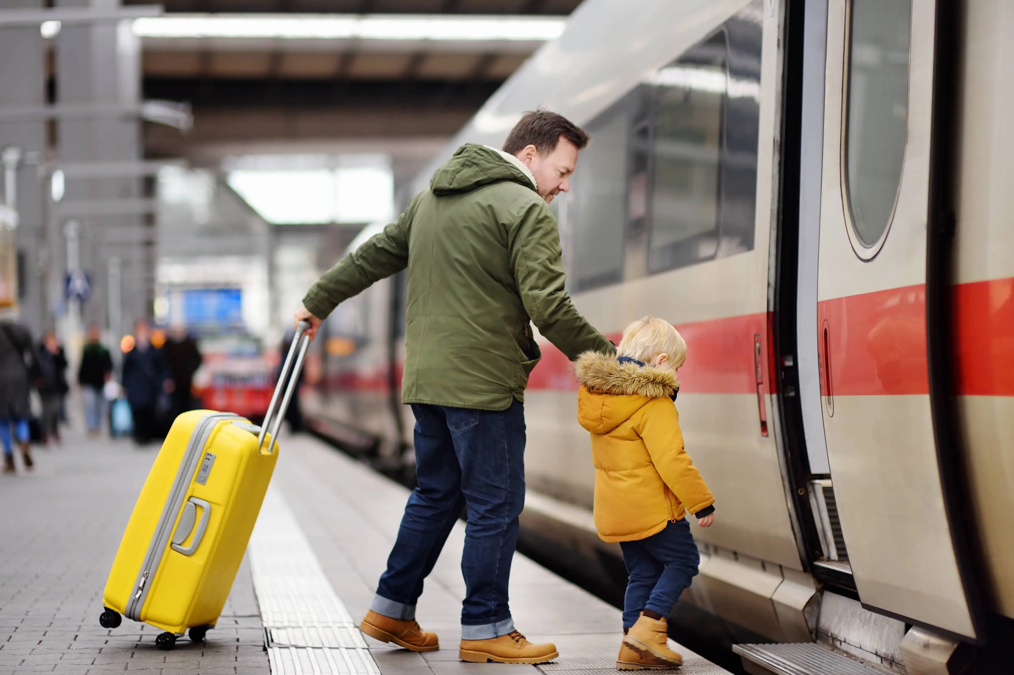 The Top Railway Museums in the UK: Little boy and his father getting on a train