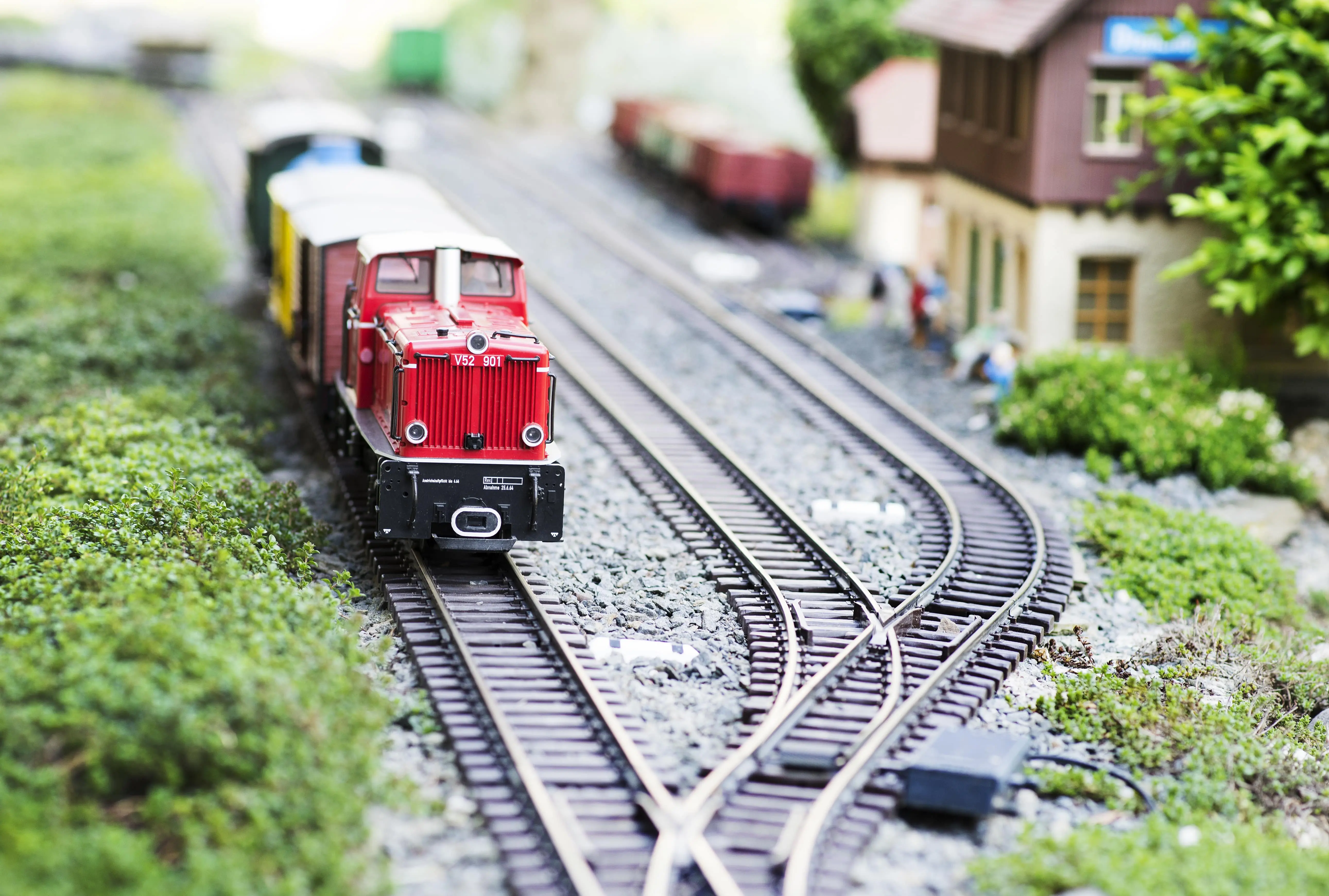 Model Trains: A model railway with red train cart pulling away